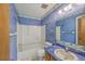 Full bathroom with blue wallpaper and a shower/tub combo at 312 Woodward Blvd, Summerville, SC 29483