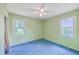 This bedroom features a ceiling fan, carpet flooring, two windows that let in natural light at 312 Woodward Blvd, Summerville, SC 29483