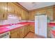 Kitchen with plenty of wooden cabinets and white appliances at 312 Woodward Blvd, Summerville, SC 29483