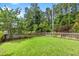Spacious backyard with a well-maintained lawn and wood fence at 340 Stefan Dr, Charleston, SC 29412