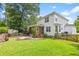 Charming backyard with a patio, manicured lawn, and access to screened in porch at 340 Stefan Dr, Charleston, SC 29412