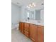 Bright bathroom includes a double sink vanity, ample lighting, and tile flooring at 340 Stefan Dr, Charleston, SC 29412