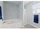 The bathroom is equipped with a soaking tub and a separate glass-enclosed shower at 340 Stefan Dr, Charleston, SC 29412