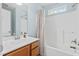 Inviting bathroom with wood vanity and shower-tub combo with curtain at 340 Stefan Dr, Charleston, SC 29412