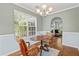 Inviting dining room with a round wooden table, chandelier, and view to living room via an open archway at 340 Stefan Dr, Charleston, SC 29412