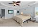 Well-lit main bedroom with ceiling fan, neutral carpet, and two windows providing ample sunlight at 340 Stefan Dr, Charleston, SC 29412