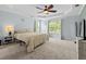 Spacious main bedroom boasts natural light, ceiling fan, tray ceiling, and neutral carpet at 340 Stefan Dr, Charleston, SC 29412