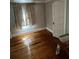 Bedroom featuring hardwood floors, curtains, and a white door at 3646 Hilton Dr, Johns Island, SC 29455