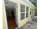 Exterior of a yellow home, showing hardwood flooring, kitchen, and backyard at 3646 Hilton Dr, Johns Island, SC 29455