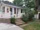 Charming home with a welcoming front porch, wooden decking and freshly painted trim at 3646 Hilton Dr, Johns Island, SC 29455
