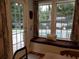 Inviting window nook with a view of the pool, hardwood floors, and custom window seat at 3646 Hilton Dr, Johns Island, SC 29455