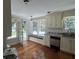 Cozy kitchen featuring white cabinets, stainless steel appliances, window seat and pool views at 3646 Hilton Dr, Johns Island, SC 29455