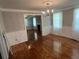 Living room with hardwood floors, chair rail, chandelier, fireplace views and lots of natural light at 3646 Hilton Dr, Johns Island, SC 29455