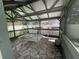 View of screened porch with stone tile and hanging swing for lounging at 3646 Hilton Dr, Johns Island, SC 29455
