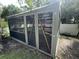 Enclosed screened porch with stone tile and vaulted roof offers outdoor relaxation at 3646 Hilton Dr, Johns Island, SC 29455