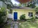 Charming shed exterior featuring blue door, window unit, and stone pathway at 3646 Hilton Dr, Johns Island, SC 29455