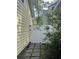 Exterior shot of a well-maintained side yard with a privacy gate and stepping stone pathway at 3646 Hilton Dr, Johns Island, SC 29455