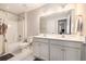 Well-lit bathroom features a double vanity with ample counter space and a shower-tub combo at 4117 Rigsby Ln, Charleston, SC 29414