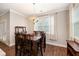 Formal dining room with decorative light fixture and large windows at 4117 Rigsby Ln, Charleston, SC 29414