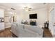 Comfortable living room with hardwood floors, tv, and neutral color palette at 4117 Rigsby Ln, Charleston, SC 29414