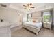 Bright main bedroom with tray ceiling, ensuite, and neutral carpet at 4117 Rigsby Ln, Charleston, SC 29414