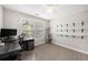 Bright home office complete with desk, shelves, and cat tree at 4117 Rigsby Ln, Charleston, SC 29414