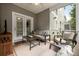 Relaxing screened porch furnished with comfortable seating and ceiling fan at 4117 Rigsby Ln, Charleston, SC 29414