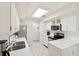 Bright kitchen with stainless steel appliances, white cabinetry, and quartz countertops at 4856 Green Dolphin Way # Share 6, Kiawah Island, SC 29455