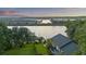 Breathtaking aerial view of the home, showcasing its riverfront location and lush landscape at 4940 Lambs Rd, North Charleston, SC 29418