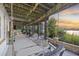 An outdoor patio features a swing and lounge chairs with a nice view of the water at 4940 Lambs Rd, North Charleston, SC 29418