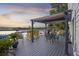 Outdoor living area featuring comfortable seating, lake view, and space for entertaining guests at 4940 Lambs Rd, North Charleston, SC 29418