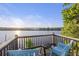Deck overlooking lake with lounge chairs and grill, perfect for sunset views and gatherings at 4940 Lambs Rd, North Charleston, SC 29418