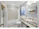The bathroom has tile floors, gray walls, granite vanity, and a shower/tub combo at 4940 Lambs Rd, North Charleston, SC 29418