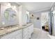 Bright bathroom featuring double vanity with granite countertop and white cabinets at 4940 Lambs Rd, North Charleston, SC 29418