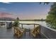 Relax on the deck with a river view, comfortable chairs, and grill setup at sunset at 4940 Lambs Rd, North Charleston, SC 29418
