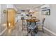 Cozy dining area adjacent to the kitchen with space for four, and wood style floors at 4940 Lambs Rd, North Charleston, SC 29418