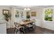 Bright dining room featuring wood floors, stylish chairs, and lots of natural light at 4940 Lambs Rd, North Charleston, SC 29418