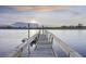 A wooden dock extends over the river providing access for boating and other activities at 4940 Lambs Rd, North Charleston, SC 29418