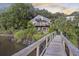 Charming waterfront home with multi-level decks and a private walkway leading to the water at 4940 Lambs Rd, North Charleston, SC 29418
