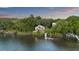 View of gorgeous house with private dock with slide and a pier on the waterway at 4940 Lambs Rd, North Charleston, SC 29418