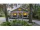 Beautiful brick home with a welcoming front porch and meticulously landscaped yard at 4940 Lambs Rd, North Charleston, SC 29418