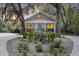 Charming brick home with manicured front yard framed by mature trees with Spanish moss at 4940 Lambs Rd, North Charleston, SC 29418
