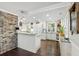 Well-lit kitchen featuring granite countertops, white cabinetry and stainless appliances at 4940 Lambs Rd, North Charleston, SC 29418