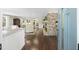 Open concept living room with hardwood floors, stone fireplace and neutral decor at 4940 Lambs Rd, North Charleston, SC 29418