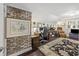 Cozy home office with built-in desk, exposed brick, and hardwood floors at 4940 Lambs Rd, North Charleston, SC 29418