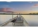 View down long wooden pier showing calm waterway and colorful sunset at 4940 Lambs Rd, North Charleston, SC 29418