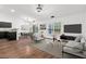 An open-concept living room offers great flow and modern finishes, and plenty of space for entertaining at 5024 Blair Rd, Summerville, SC 29483