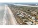 Expansive aerial view of the coastline featuring charming homes near the beach at 504 W Ashley Ave, Folly Beach, SC 29439