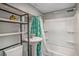 Functional bathroom featuring a shower/tub combo with a stylish curtain, a sleek sink, and shelving for storage at 504 W Ashley Ave, Folly Beach, SC 29439
