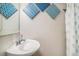 Clean bathroom with a modern sink and shower with a decorative geometric pattern at 504 W Ashley Ave, Folly Beach, SC 29439